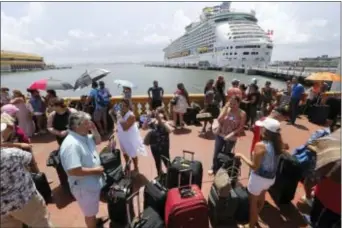  ?? GERALD HERBERT -THE ASSOCIATED PRESS ?? In this Sept. 28 file photo, thousands of people evacuating Puerto Rico line up to get on a cruise ship in the aftermath of Hurricane Maria, in San Juan, Puerto Rico. Across the U.S., but particular­ly in states with large Puerto Rican population­s such...