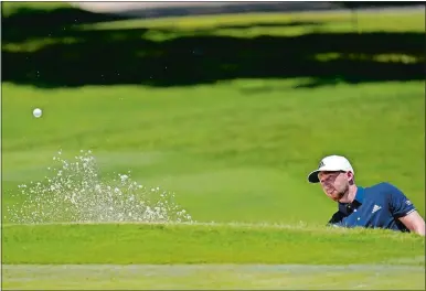  ?? DAVID J. PHILLIP/AP PHOTO ?? Daniel Berger hits out of a bunker on the first hole during the final round of the Charles Schwab Challenge on Sunday at the Colonial Country Club in Fort Worth, Texas. Berger won on the first playoff hole.