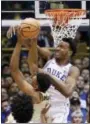  ?? GERRY BROOME - AP ?? Duke’s Wendell Carter Jr., top, blocks Wake Forest’s Doral Moore during the first half of an NCAA college basketball game in Durham, N.C., Saturday.