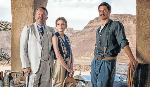  ??  ?? PYRAMID SCHEME: Lord George Carnarvon (Sam Neill), Evelyn (Amy Wren) and Howard Carter (Max Irons)