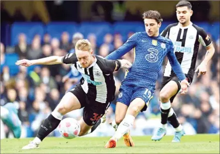  ?? AFP ?? Newcastle United striker Dwight Gayle (left) vies with Chelsea midfielder Mason Mount (centre) during the English Premier League football match on March 13.