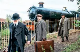  ?? ?? William T Kirkpatric­k and CS Lewis leave the station, while Max McLean, who plays C S Lewis as an older man, follows them.