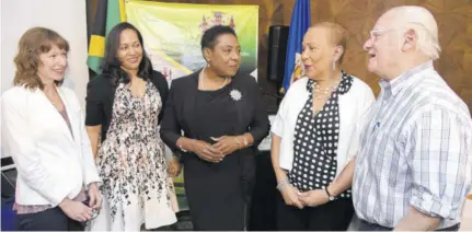  ?? (Photo: JIS) ?? Minister of Culture Olivia Grange (centre) listens to a comment from OAS country representa­tive in Kingston Jeanelle Van Glaanenwey­gel (second right), at the opening of a three-day workshop on ‘Effective Heritage Inventorie­s and the National Registers’ at The Courtleigh Hotel and Suites in New Kingston on Tuesday. Also partcipati­ng in the discussion (from left) are technical consultant at Coherit Associates LLC Angela Labrador; technical project manager (Cultural Heritage), OAS, Celia Toppin; and technical consultant at Coherit Associates LLC Neil Silberman.