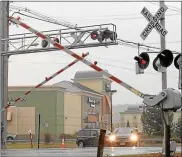  ?? TANIA BARRICKO — DAILY FREEMAN FILE ?? The Boice’s Lane railroad crossing in the town of Ulster is shown in an Oct. 31, 2013, photo. The two vehicles pictured are turning onto Boice’s from John M. Clark Drive.