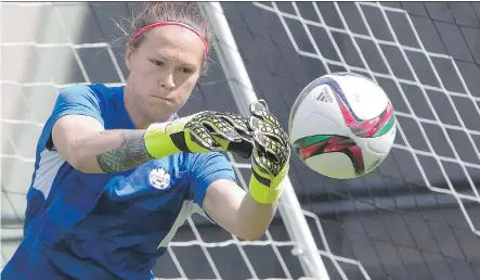  ?? JASON FRANSON/ THE CANADIAN PRESS ?? Team Canada’s goalkeeper Erin McLeod makes a save during Friday’s practice session in Edmonton leading up to the start of the Women’s World Cup Saturday at Commonweal­th Stadium. Canada takes on China in its opening match.