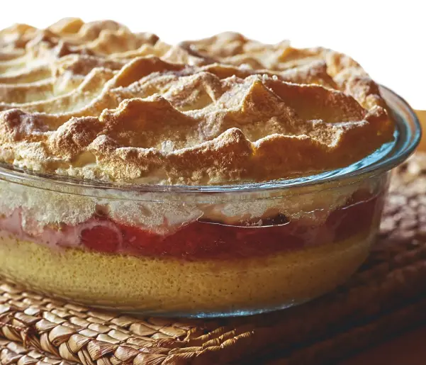  ??  ?? A dish fit for royalty: this queen of puddings has a luscious rasperry-compote seam layered above buttery brioche crumbs