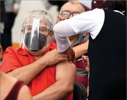  ?? JOSE M. RUIZ / POLARIS ?? A man receives a shot of the Chinese-made CoronaVac at a vaccinatio­n center in the Mexican city of Ecatepec on March 22.