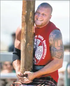  ?? DOUG DURAN — STAFF ARCHIVES ?? Adam Brezina, of Phoenix, Ariz. competed in the caber toss at the Scottish Highland Gathering and Games three years ago. The games return this weekend.