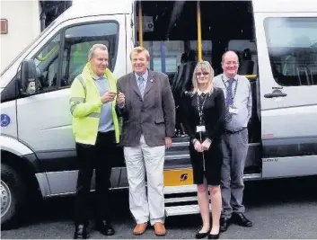  ??  ?? On the road Driver Allan Steel, Cllr Harry Cartmill, Elizabeth Bryce and John Tripney with the new minibus