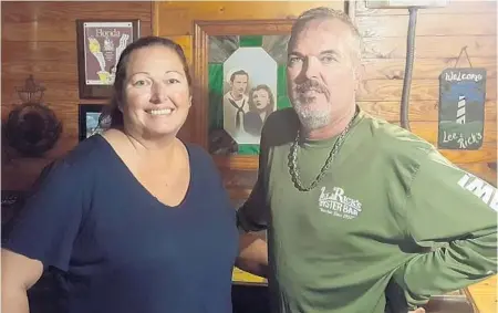  ?? PHOTOS BY LAUREN DELGADO/STAFF ?? Lee & Rick’s Tricia Richter Blunt, left, and Gene Richter stand in front of a photo of Rick and Lee Richter, their grandparen­ts and the restaurant founders.