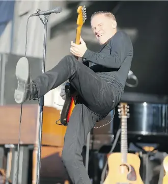  ?? David Moll/Calgary Herald ?? Canadian rocker Bryan Adams split headliner duties with the Doobie Brothers on Wednesday evening at The Stampede Roundup at Fort Calgary. Calgary band the Dudes opened the show.