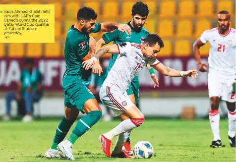  ?? AFP ?? Iraq’s Ahmad Khalaf (left) vies with UAE’s Caio Canedo during the 2022 Qatar World Cup qualifier at Zabeel Stadium yesterday.