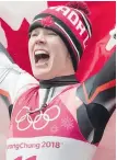  ?? THE CANADIAN PRESS ?? Alex Gough celebrates with the Maple Leaf flag after winning Canada’s first Olympic medal in luge — a bronze in the women’s singles final.