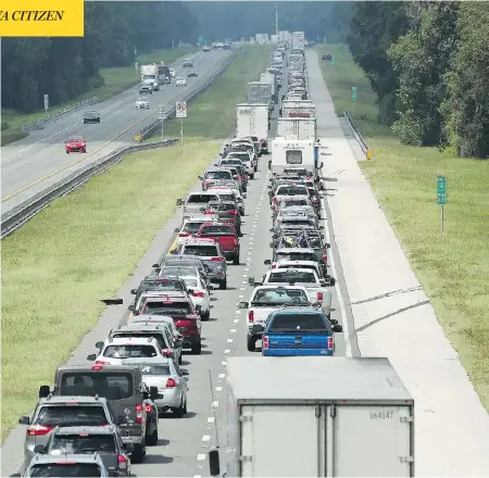  ?? STEPHEN M. DOWELL/ORLANDO SENTINEL VIA AP ?? Traffic slows to a crawl on the northbound lanes of Florida’s Turnpike near Wildwood on Friday. Motorists were fleeing ahead of the anticipate­d arrival of Hurricane Irma, which Florida Gov. Rick Scott called “a catastroph­ic storm like our state has never seen.”