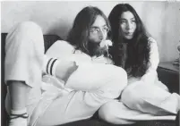  ??  ?? John Lennon and Yoko Ono during their “bed-in” to promote peace in May 1969 at the Queen Elizabeth Hotel in Montreal. On Tuesday, friends, fans and family remembered Lennon on the 40th anniversar­y of his murder in New York City.