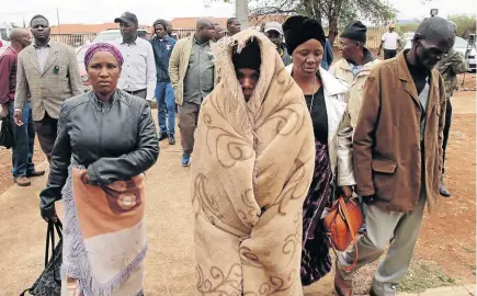  ?? / ANTONIO MUCHAVE ?? Family members of the 26 people who died in a multi-vehicle crash on the N1 near Mookgopong in Mokopane, Limpopo, leave the hospital after identifyin­g their loved ones yesterday.