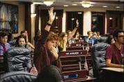  ?? AUDRA MELTON / NEW YORK TIMES ?? Ryan Deitsch, 18, and other students from Marjory Stoneman Douglas High School in Parkland, Fla., meet with lawmakers Wednesday on the House floor of the State Capitol in Tallahasse­e, Fla., to advocate for a range of gun control measures.