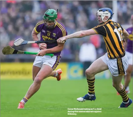  ??  ?? Conor McDonald taking on T.J. Reid during that memorable win against Kilkenny.