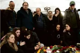  ?? AMIR LEVY/GETTY IMAGES ?? Family and friends mourned during a funeral for Captain Nir Binyamin, killed in a battle in Gaza, Tuesday in Israel.