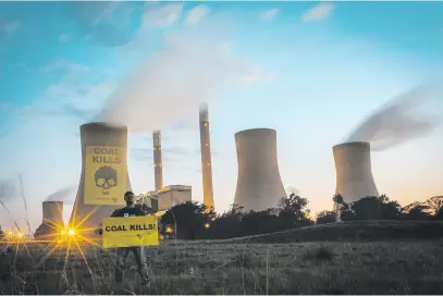  ?? Picture: Greenpeace ?? WARNING. Greenpeace Africa puts a ‘coal kills’ message on Duvha coal-fired power station in Mpumalanga and calls on government to ensure Eskom complies with air quality legislatio­n.