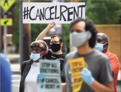  ?? Hearst Connecticu­t Media file photo ?? Activists press for rent relief last June outside McQueeney Towers in New Haven. On Monday, Gov. Ned Lamont announced renters under financial duress as a result of the pandemic can apply for up to $10,000 in rent assistance, with those behind on their electric bills possibly eligible for up to $1,500.