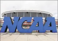  ?? Streeter Lecka / Getty Images ?? The NCAA logo is seen outside the Georgia Dome before the men’s Final Four in April 2013.