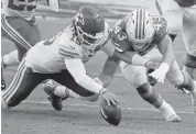  ?? CHARLES TRAINOR JR. ctrainor@miamiheral­d.com ?? The Dolphins forced Chiefs quarterbac­k Patrick Mahomes, left, to throw three intercepti­ons and fumble once.