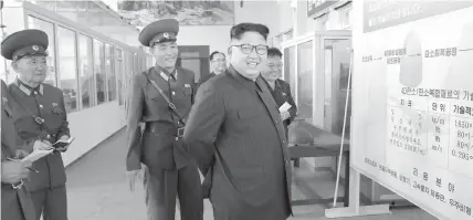  ?? AGENCE FRANCE PRESSE ?? North Korean leader Kim Jong-Un visits the Chemical Material Institute of the Academy of Defense Science at an undisclose­d location.