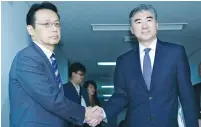  ?? (Reuters) ?? SUNG KIM (right), the US State Department’s special representa­tive for North Korea Policy, is greeted by Kenji Kanasugi, director-general for Asian and Oceanian affairs at the Japanese Foreign Ministry, in Tokyo yesterday.