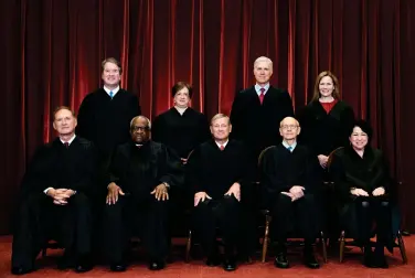  ?? (Erin Schaff/The New York Times via AP, Pool, File) ?? Members of the Supreme Court pose for a group photo at the Supreme Court in Washington, April 23, 2021. Seated from left are Associate Justice Samuel Alito, Associate Justice Clarence Thomas, Chief Justice John Roberts, Associate Justice Stephen Breyer and Associate Justice Sonia Sotomayor, Standing from left are Associate Justice Brett Kavanaugh, Associate Justice Elena Kagan, Associate Justice Neil Gorsuch and Associate Justice Amy Coney Barrett.