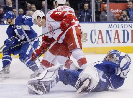  ?? CARLOS OSORIO/TORONTO STAR ?? Nick Jensen of the Wings collides with Leafs netminder Frederik Andersen in the second period of Tuesday night’s game at the ACC.