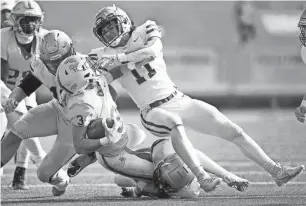  ?? ANDREW NELLES/TENNESSEAN ?? CPA’s Crews Law (11) pushes down Boyd Buchanan’s Sebastian Jones (3) during the fourth quarter of a Division II-AA championsh­ip game at Finley Stadium in Chattanoog­a on Nov. 30.