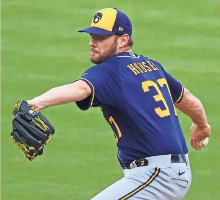  ?? ASSOCIATED PRESS ?? Brewers starter Adrian Houser was 7-5 with a 3.55 ERA in 21 games before landing on the COVID-19 list.