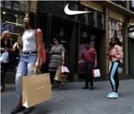  ?? MICHAEL NOBLE JR./THE ASSOCIATED PRESS FILE PHOTO ?? Clothing manufactur­ers have successful­ly been pressured into resolving disputes with subcontrac­tors, as in the case of Nike, which paid $1.5 million to Honduran workers after two subcontrac­tors closed their plants.