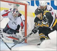  ?? AP PHOTO ?? Pittsburgh Penguins’ Bryan Rust (17) can’t get a wrap around shot past Washington Capitals goalie Braden Holtby with Alex Ovechkin defending during Game 4 in an NHL Stanley Cup Eastern Conference semifinal hockey game in Pittsburgh on Wednesday.