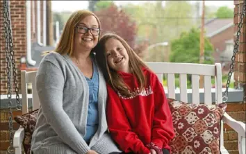  ?? Steve Mellon/Post-Gazette ?? Alison O’Malley is a nurse at UPMC Passavant who is working on her master’s degree. Here she is at home in Emsworth with daughter Addison Hase.