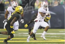  ??  ?? Stanford sophomore running back Austin Jones, breaking away against Oregon, ran for 100 yards and two touchdowns.