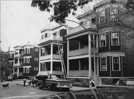  ?? HERALD ARCHIVE PHOTO ?? Dorchester triple-deckers, circa 1967.