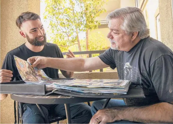  ?? IRFAN KHAN/LOS ANGELES TIMES ?? Joseph Arriaga, 29, left, reunites with his biological father Robert “Bobby” Parker, 52, visiting from Florida on May 4 in Riverside, California.