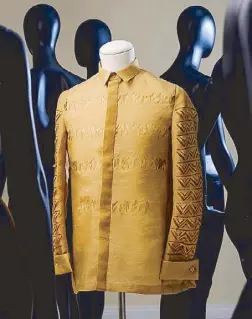  ??  ?? Celeste Volfango’s classic barong features laser-cut alibata motifs.