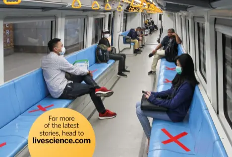  ??  ?? People sit on designated seats to ensure social distancing inside a train in Palembang, Indonesia, 20 March 2020