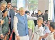  ?? PTI ?? n Prime Minister Narendra Modi interacts with children in Manila on Monday during a visit to a philanthro­pist organisati­on that provides free Indianmade prosthesis, ‘Jaipur Foot’, to amputees .