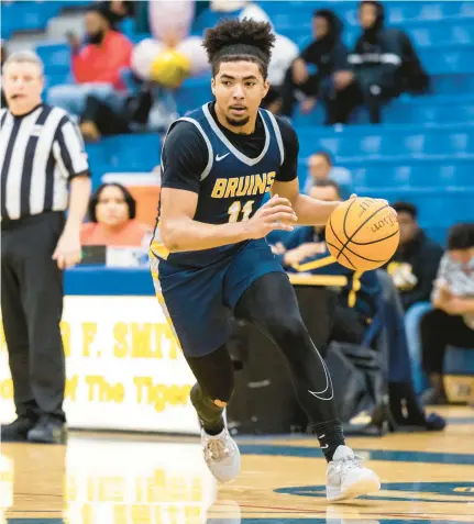  ?? KENDALL WARNER/STAFF ?? Western Branch guard Viktor Parson drives to the basket during a Jan. 23 game against Oscar Smith. Parson said the sport always brought him and his mother together. His mother, Priscila, died of cancer on Dec. 15.