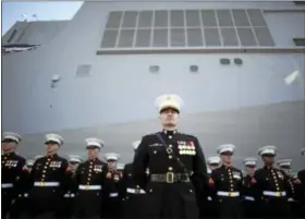  ?? ASSOCIATED PRESS ?? U.S. MARINES stand at attention during a commission­ing ceremony for the USS Somerset (LPD-25) on Saturday in Philadelph­ia. The USS Somerset is the ninth San Antonio-class amphibious transport dock and the third of three ships named in honor of those...