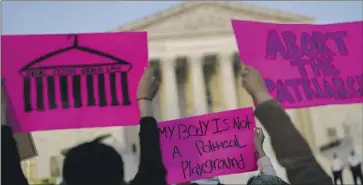  ?? Kent Nishimura Los Angeles Times ?? ABORTION RIGHTS supporters protest outside the Supreme Court on Tuesday. Groups on both sides of the issue were already preparing for an election battle, but the draft opinion on Roe vs. Wade has sped up plans.