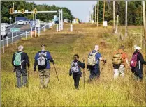  ?? CINDY SCHULTZ/THE NEW YORK TIMES ?? Volunteers search outside Moreau Lake State Park in Gansevoort, New York, for Charlotte Sena. “I promised her parents we’ll find their daughter,” Gov. Kathy Hochul said.