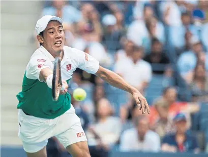  ?? TIM CLAYTON - CORBIS GETTY IMAGES ?? Kei Nishikori defeated Marin Cilic 2-6, 6-4, 7-6 (5), 4-6, 6-4 on Wednesday to reach the semifinals at the U.S. Open.