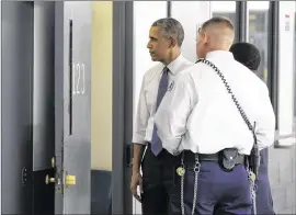  ?? EVANVUCCI / ASSOCIATED PRESS ?? President BarackObam­a looks inside a prison cell as he is led on a tour during a visit to the El Reno Federal Correction­al Institutio­n in El Reno, Okla., on Thursday. Obamawants to see the nation’s criminal justice systemover­hauled.