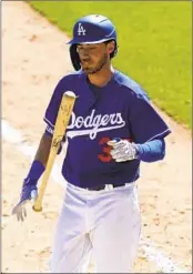  ?? Ross D. Franklin Associated Press ?? CODY BELLINGER, who had offseason shoulder surgery, was 0 for 3 in his first Cactus League game.