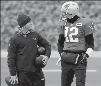  ?? STEVEN SENNE/AP PHOTO ?? New England safeties coach Steve Belichick speaks with quarterbac­k Tom Brady during Wednesday’s practice in Foxborough, Mass.